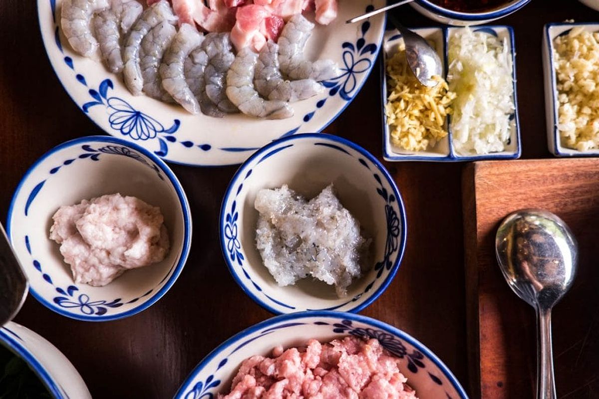 Raw pork and prawn mince and garlic in cooking class Hoi An