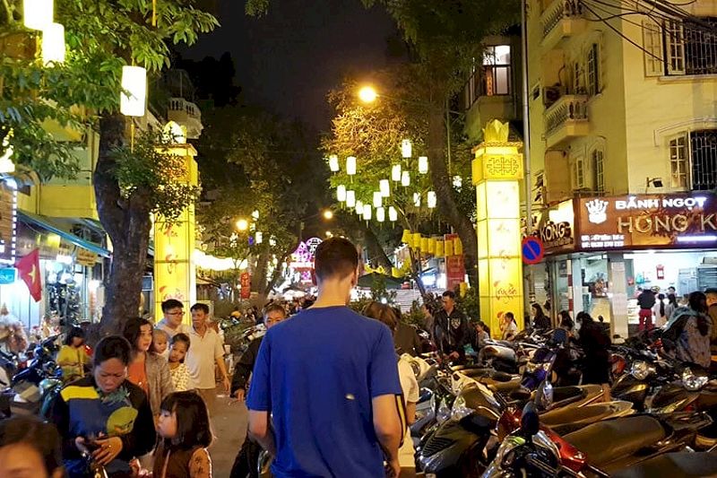 Stew walking the busy streets of Hanoi