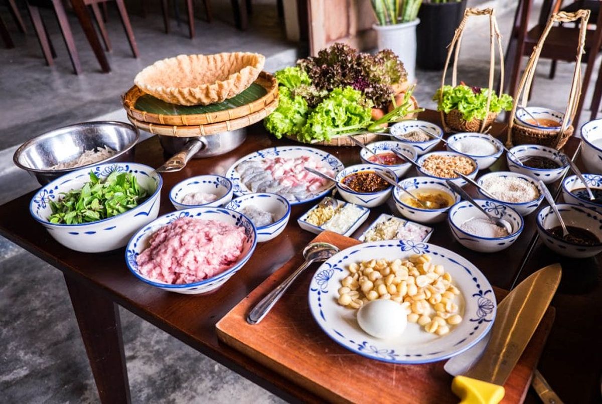 Table with various ingredients for cooking class in Hoi An