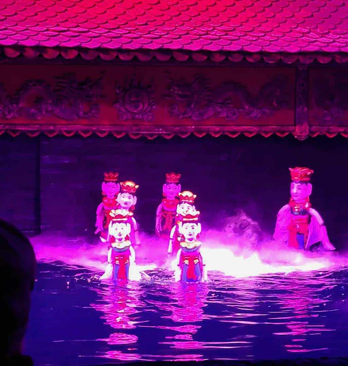 Water puppets look like they glide across the water during the show